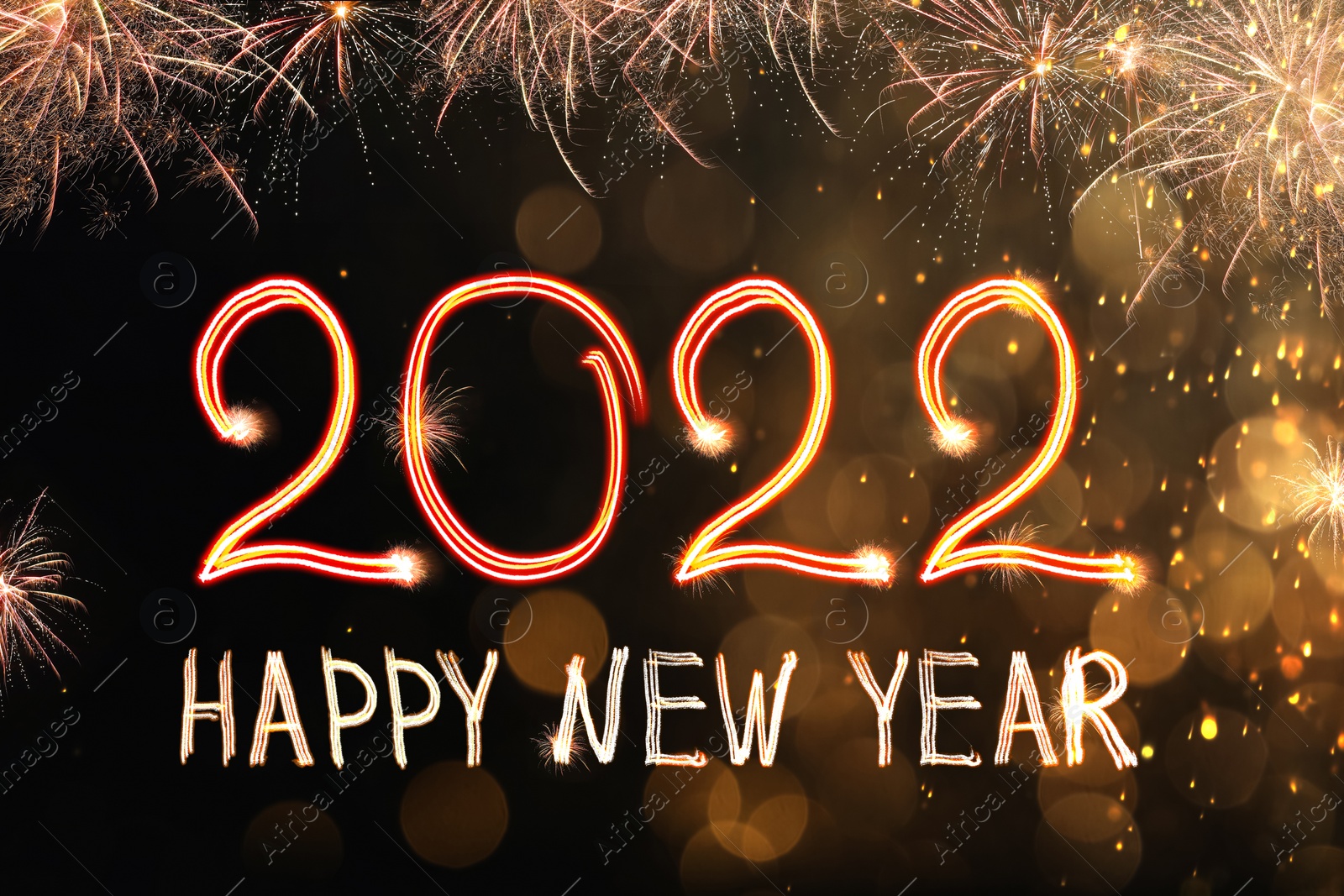 Image of Bright text Happy New 2022 Year made of firework on dark background. Greeting card design