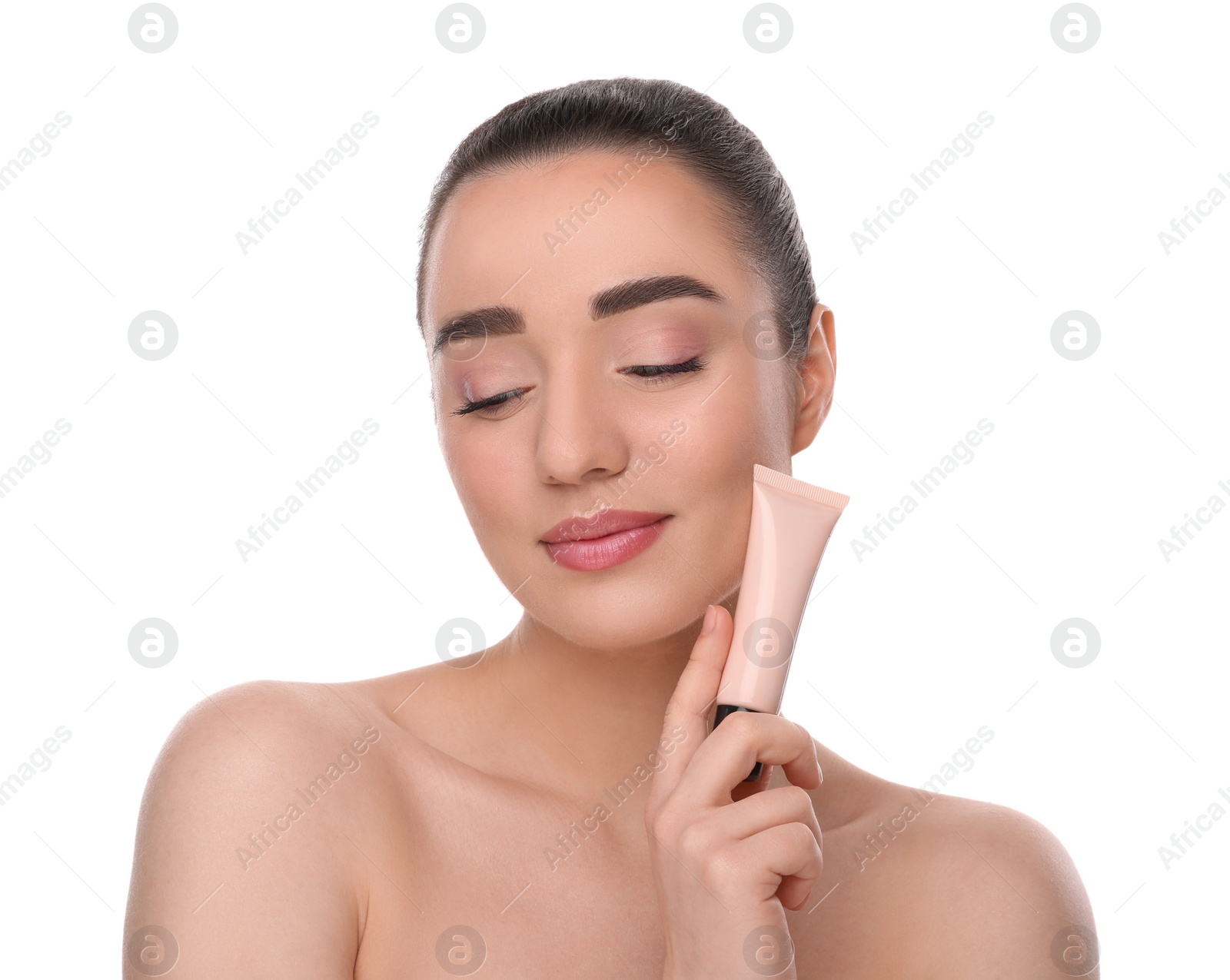 Photo of Woman holding tube of foundation on white background