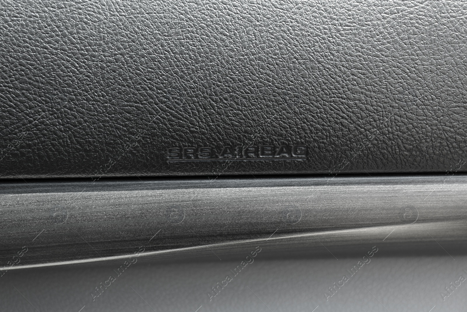 Photo of Passenger side airbag inside car, closeup view
