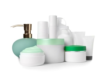 Different body care products on white background