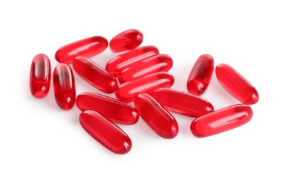 Photo of Many red pills isolated on white. Medicinal treatment