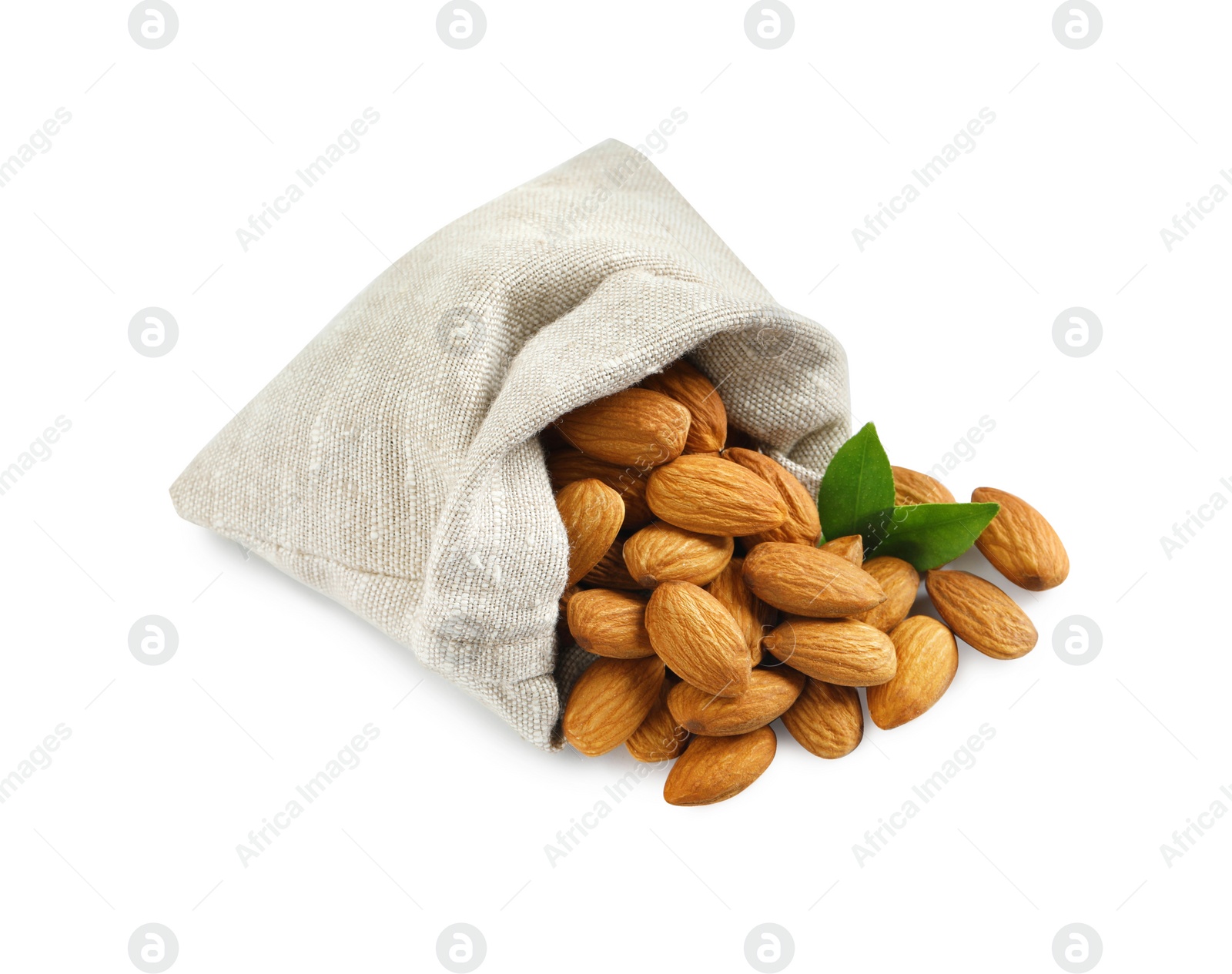 Photo of Sack with organic almond nuts and green leaves on white background. Healthy snack