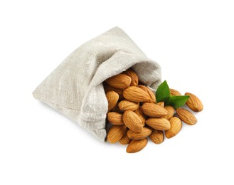 Photo of Sack with organic almond nuts and green leaves on white background. Healthy snack