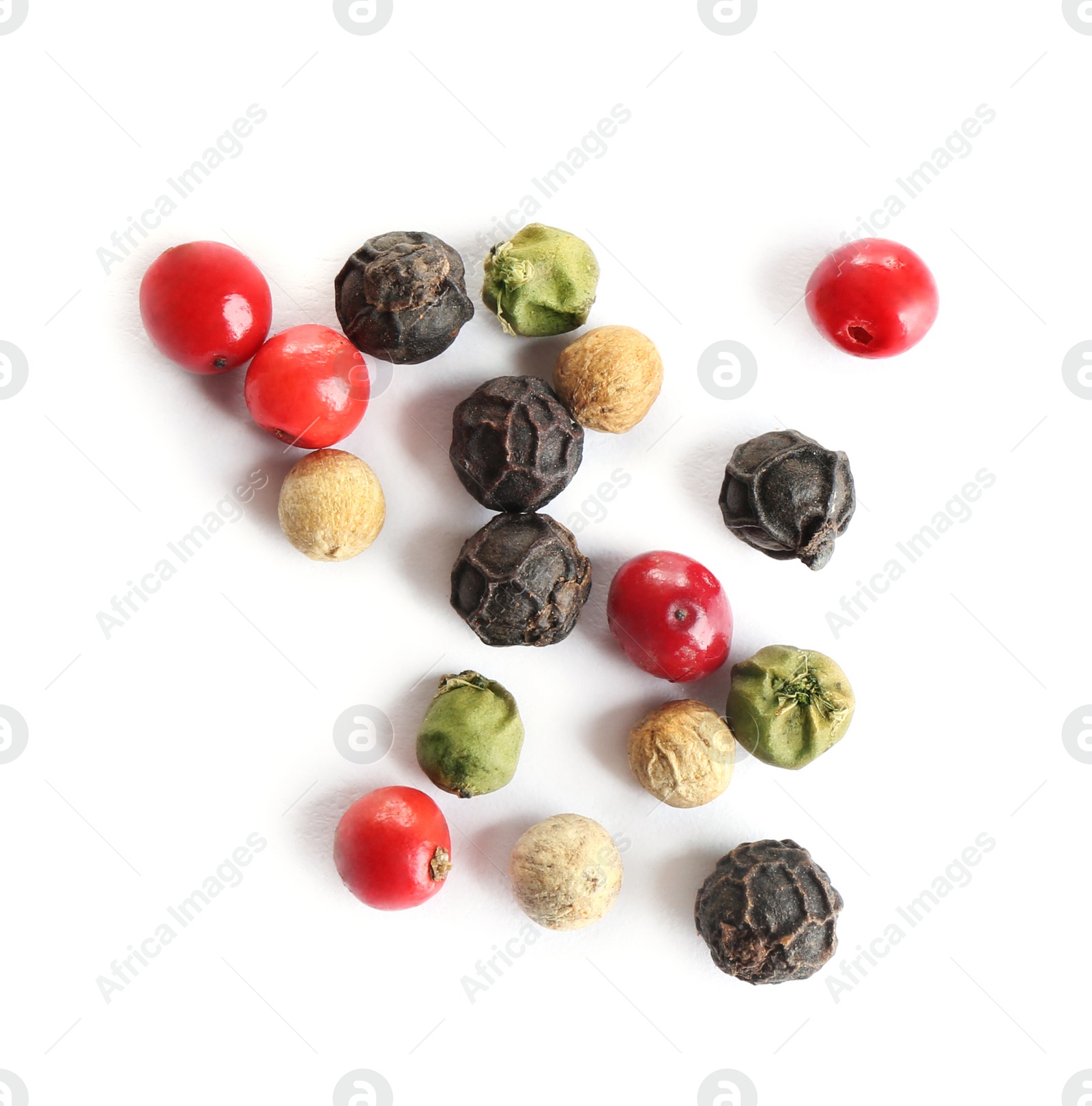 Photo of Mixed peppercorns isolated on white, top view