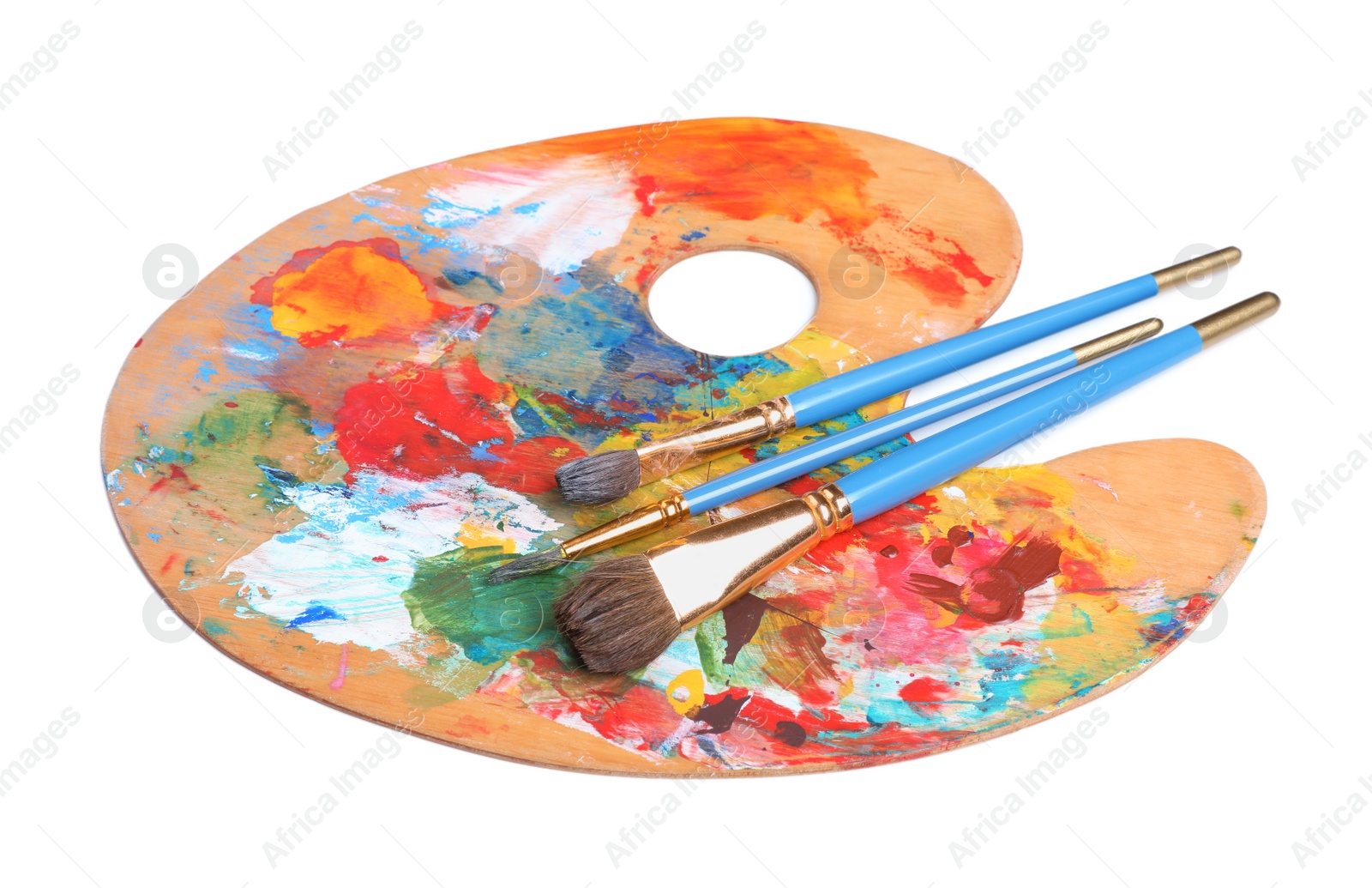 Photo of Palette with paints and brushes on white background. Artist equipment