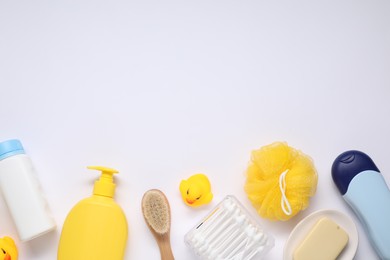 Photo of Different baby bath accessories and cosmetic products on white background, flat lay. Space for text