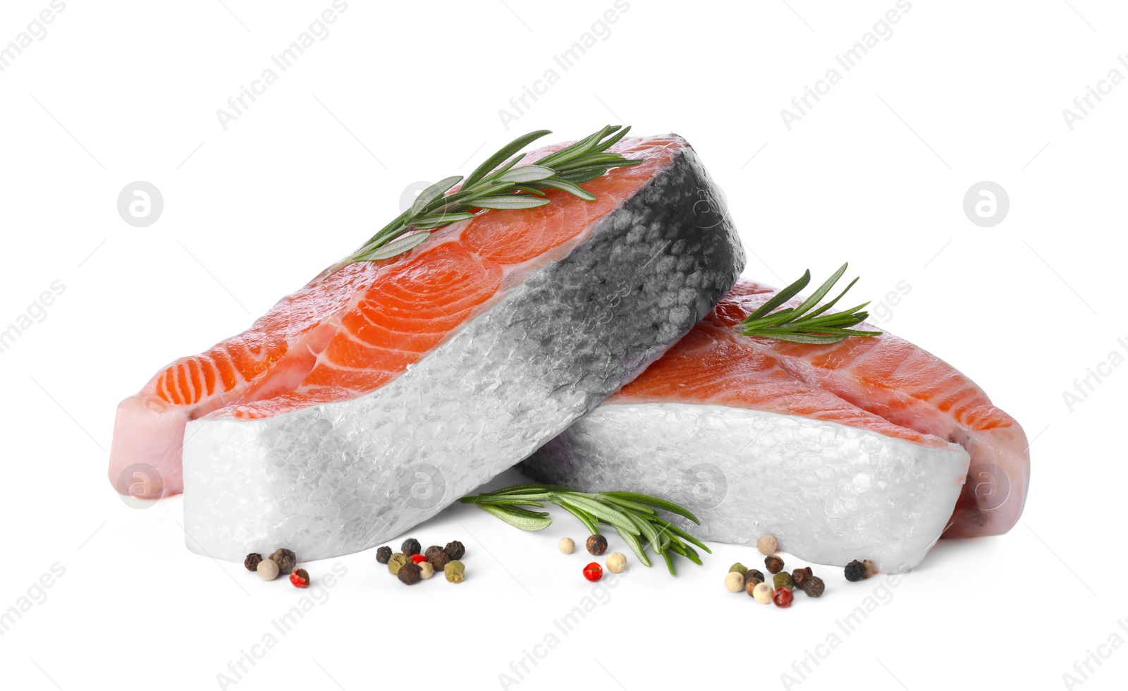 Photo of Fresh raw salmon steaks with rosemary and peppercorns on white background