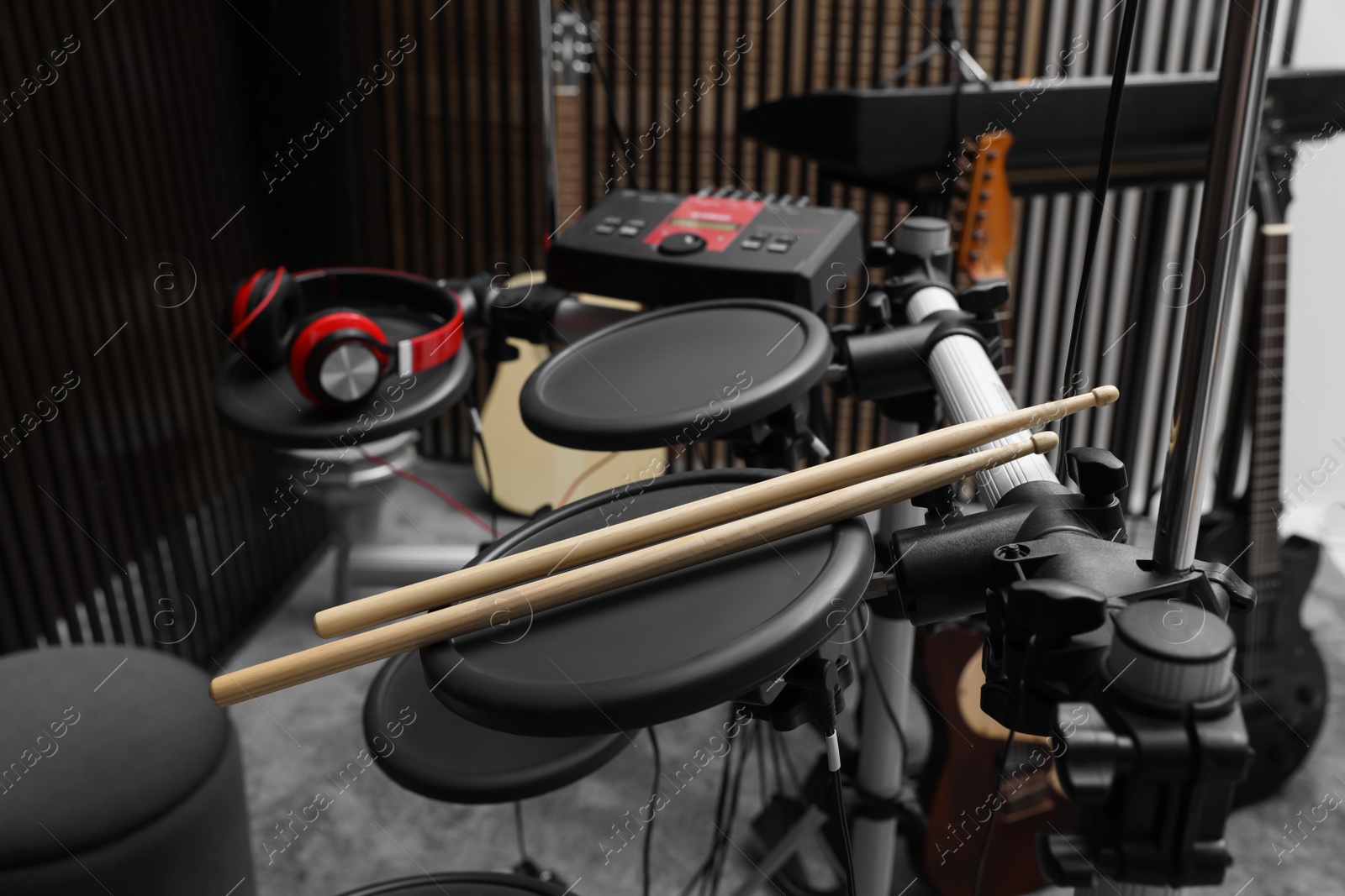 Photo of Electronic drum set at recording studio. Music band practice