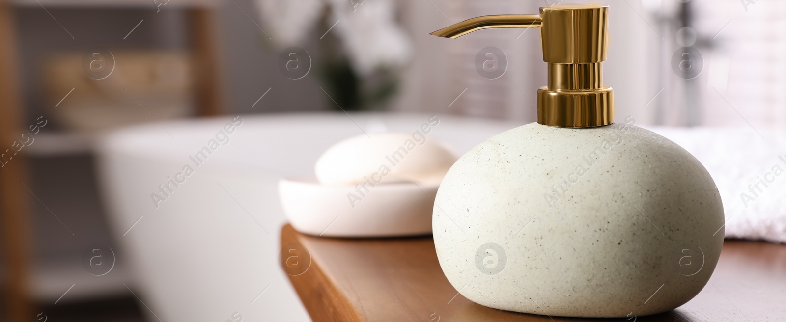 Image of Dispenser with liquid soap on wooden table in bathroom, space for text. Banner design