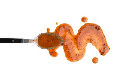 Spoon with fresh marinade isolated on white, top view