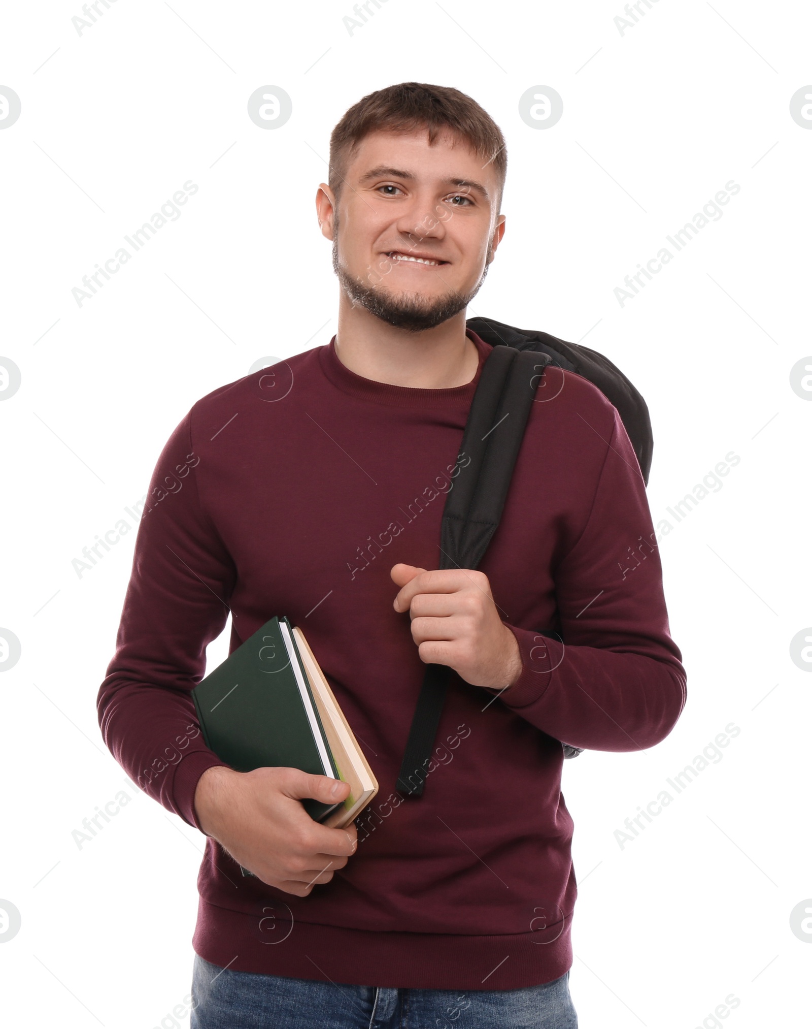 Photo of Young student with backpack and books on white background