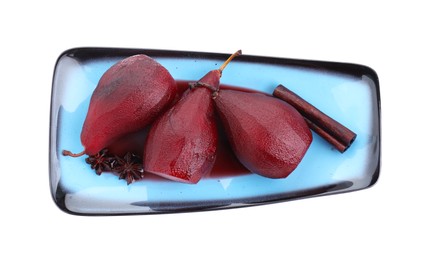 Photo of Tasty red wine poached pears and spices isolated on white, top view