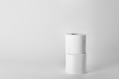 Photo of Rolls of toilet paper on white background. Space for text