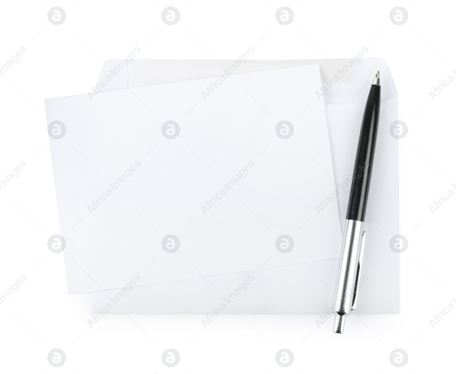 Photo of Envelope with blank letter and pen on white background, top view