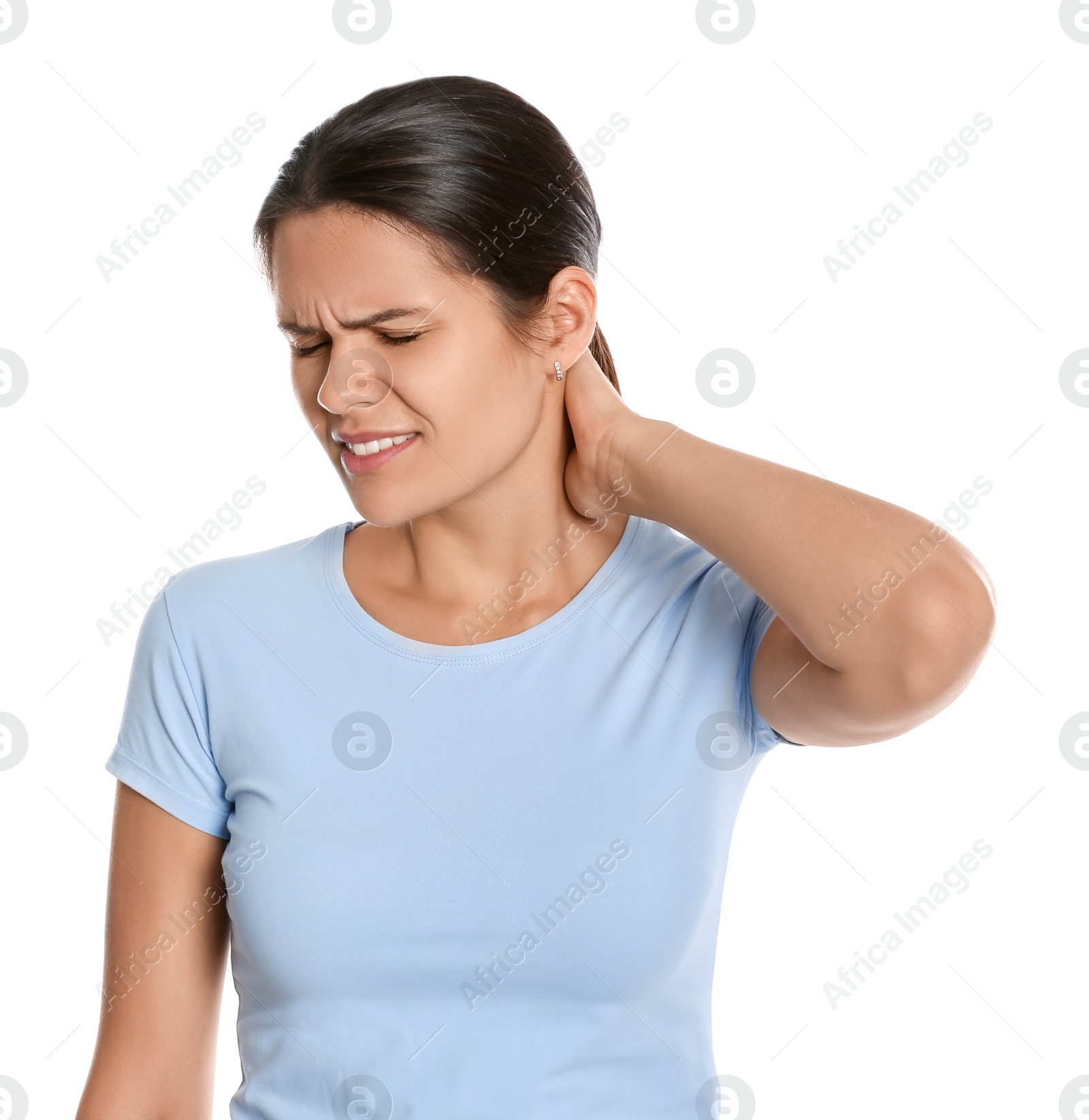 Photo of Young woman suffering from neck pain on white background