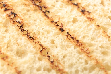 Photo of Toasted bread as background, closeup