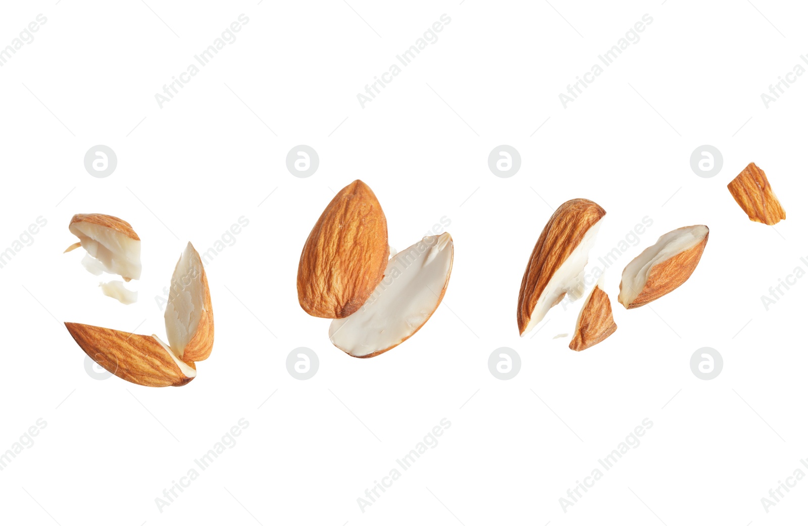 Photo of Pieces of tasty almonds on white background