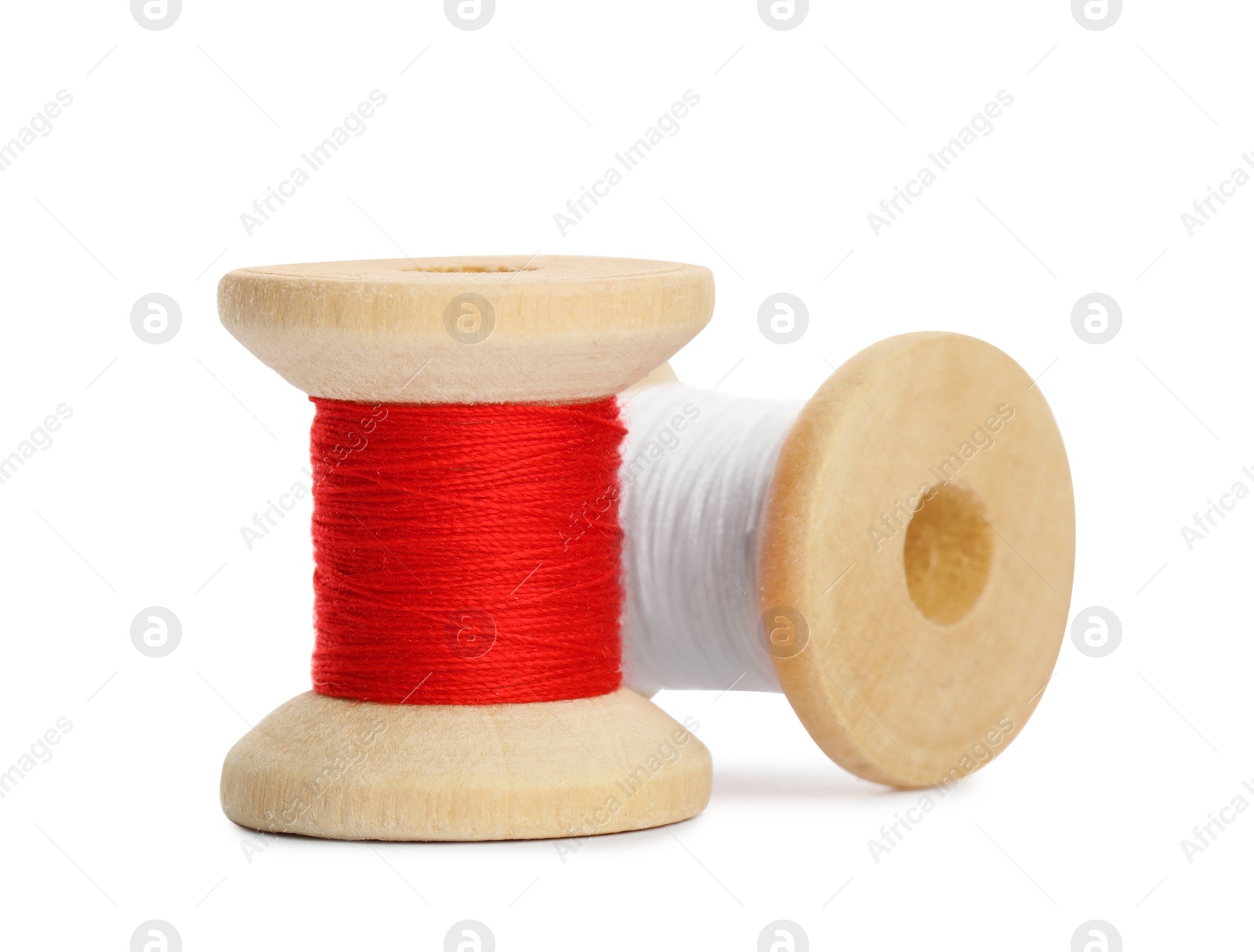 Photo of Different colorful sewing threads on white background