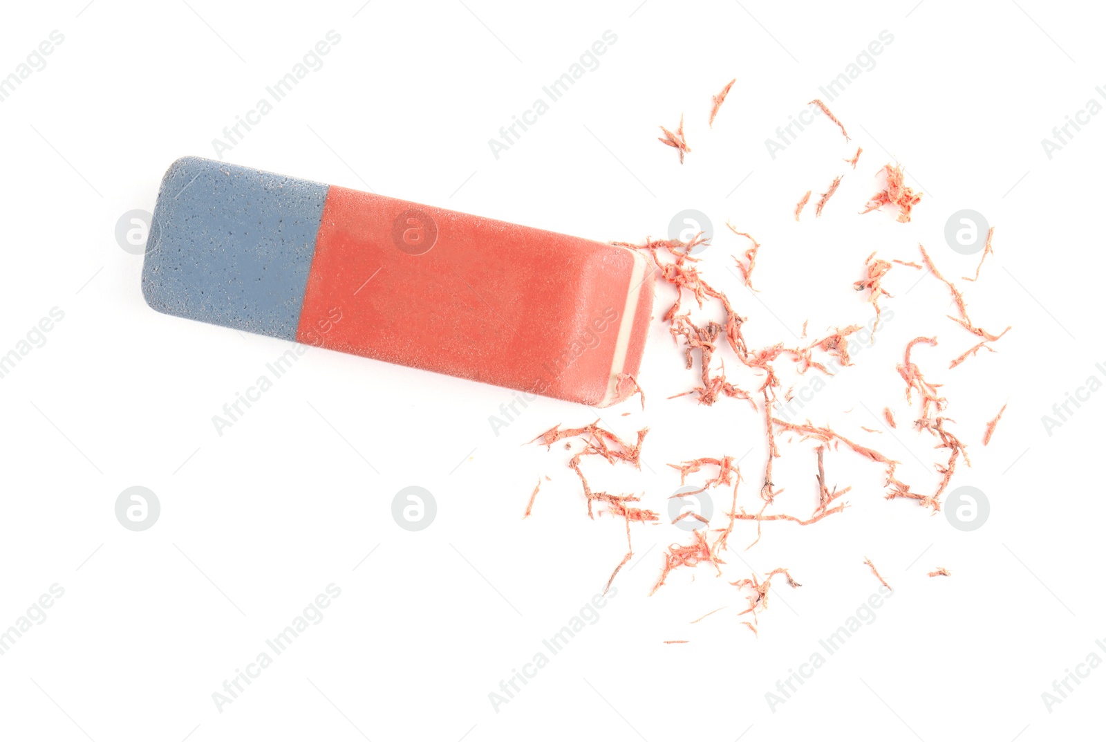Photo of Double eraser and crumbs on white background, top view
