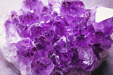 Beautiful purple amethyst gemstone on table, closeup