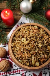 Photo of Traditional Christmas slavic dish kutia served on wooden table, above view