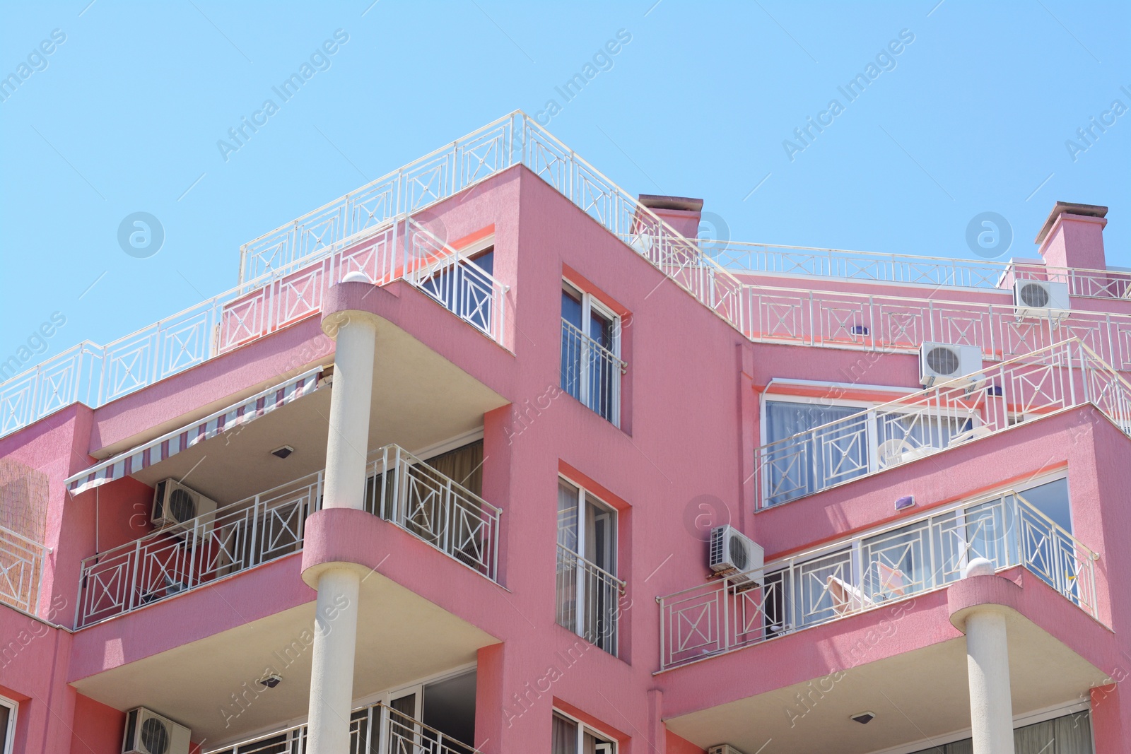 Photo of Exterior of beautiful residential building against blue sky