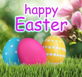 Image of Happy Easter. Bright eggs on green grass outdoors