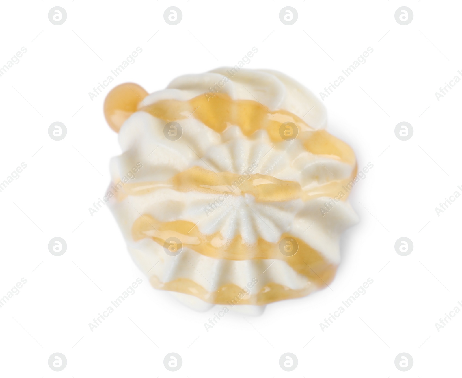 Photo of Delicious fresh whipped cream with caramel sauce isolated on white, top view