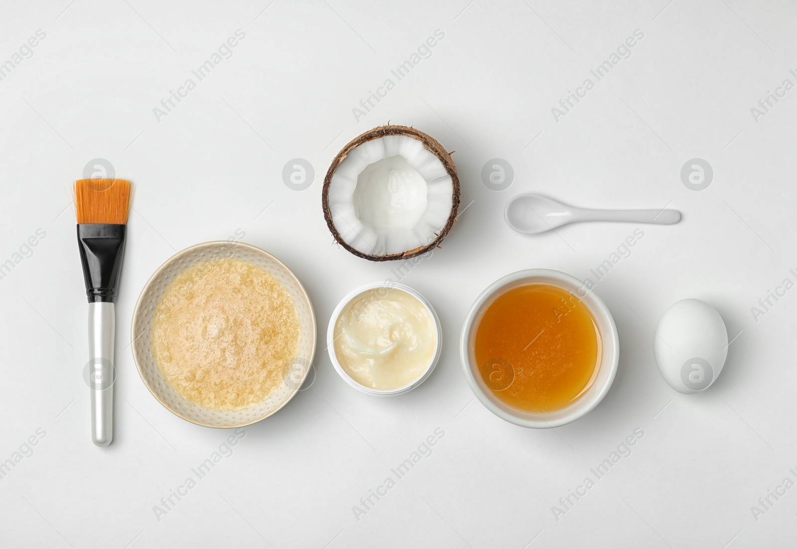 Photo of Homemade effective acne remedy and ingredients on white background