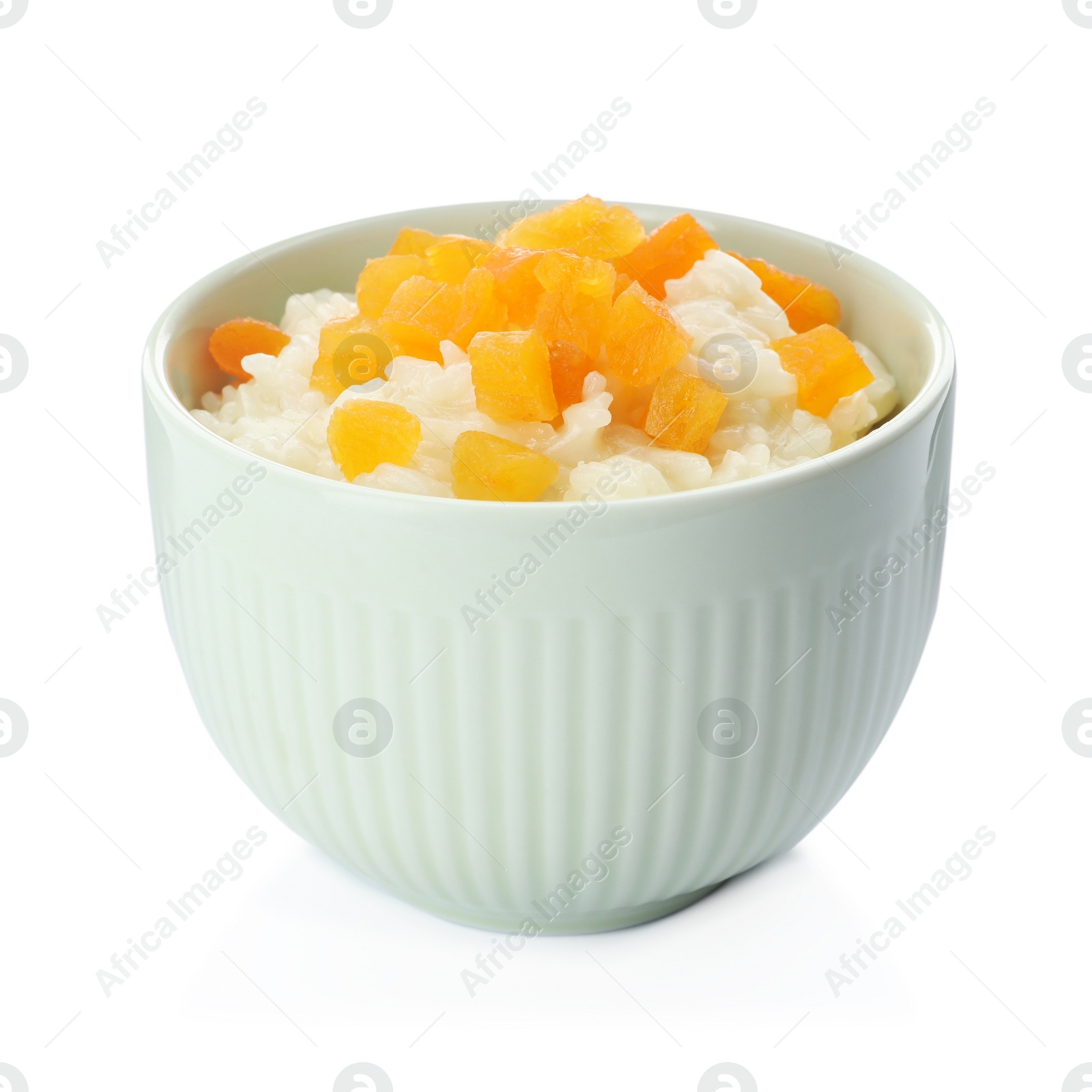 Photo of Delicious rice pudding with dried apricots isolated on white