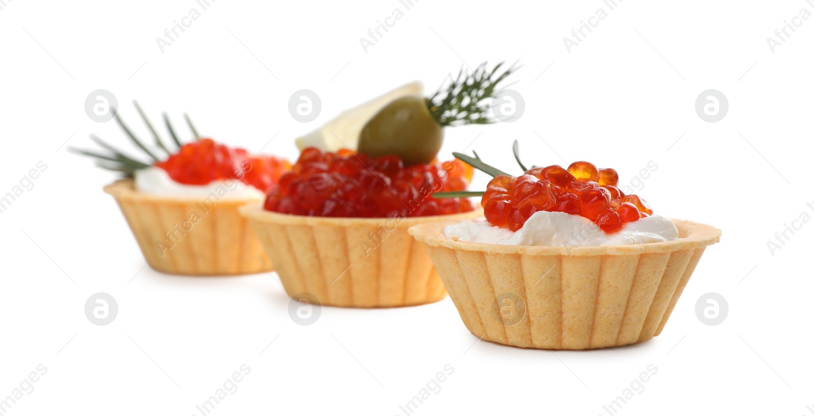 Photo of Delicious tartlets with red caviar and cream cheese on white background