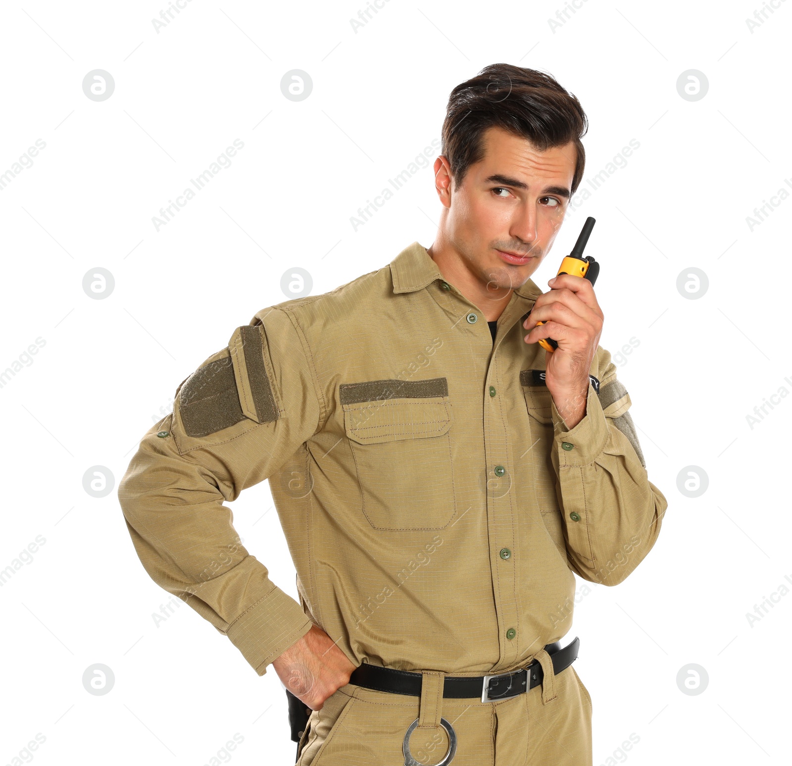 Photo of Male security guard in uniform using portable radio transmitter on white background