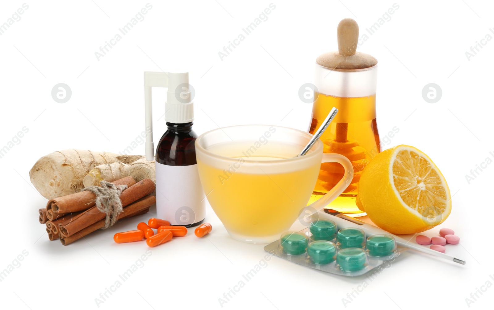 Photo of Natural and medical cold remedies on white background