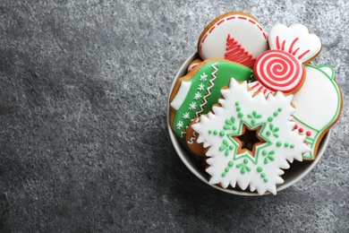 Delicious Christmas cookies on grey table, top view. Space for text