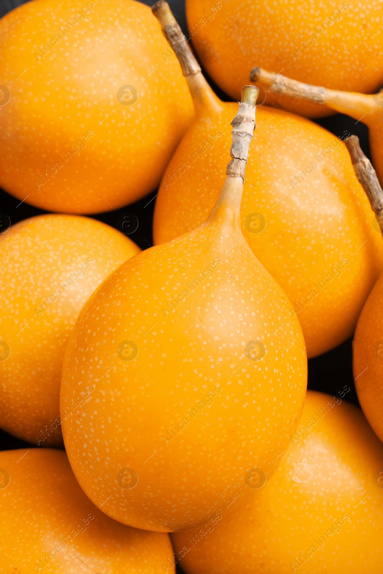 Photo of Delicious ripe granadillas as background, closeup view