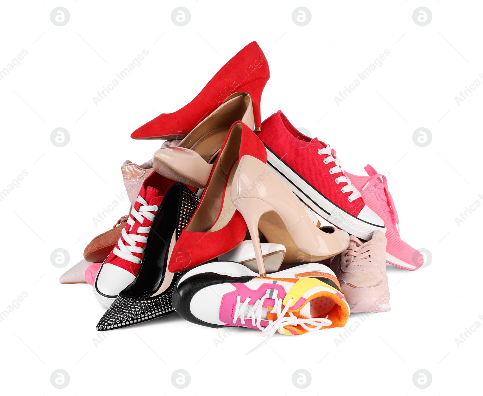 Photo of Pile of different female shoes isolated on white