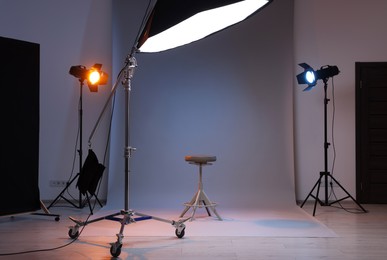 Photo of Casting call. Chair and different equipment in modern studio