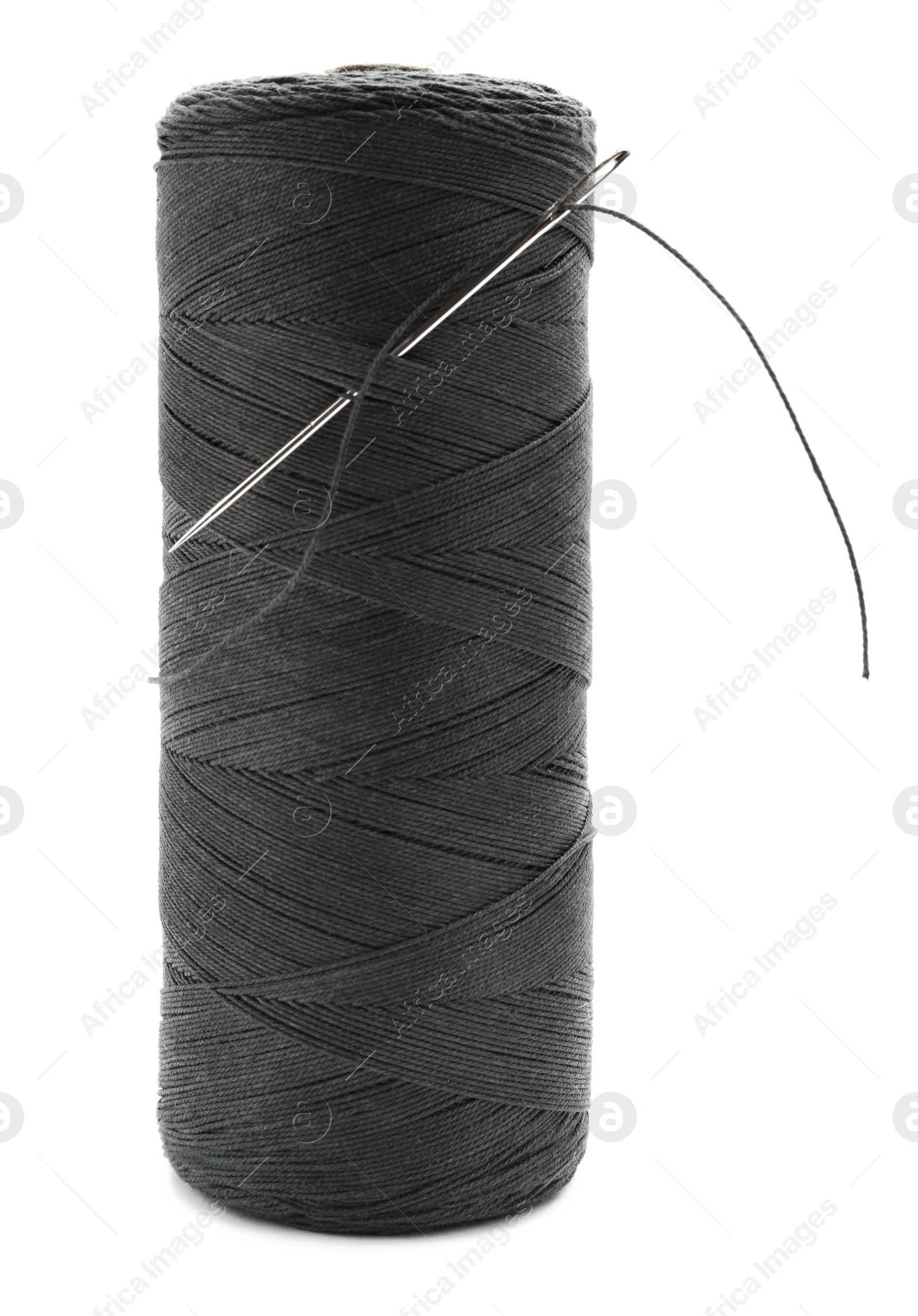 Photo of Black sewing thread with needle on white background