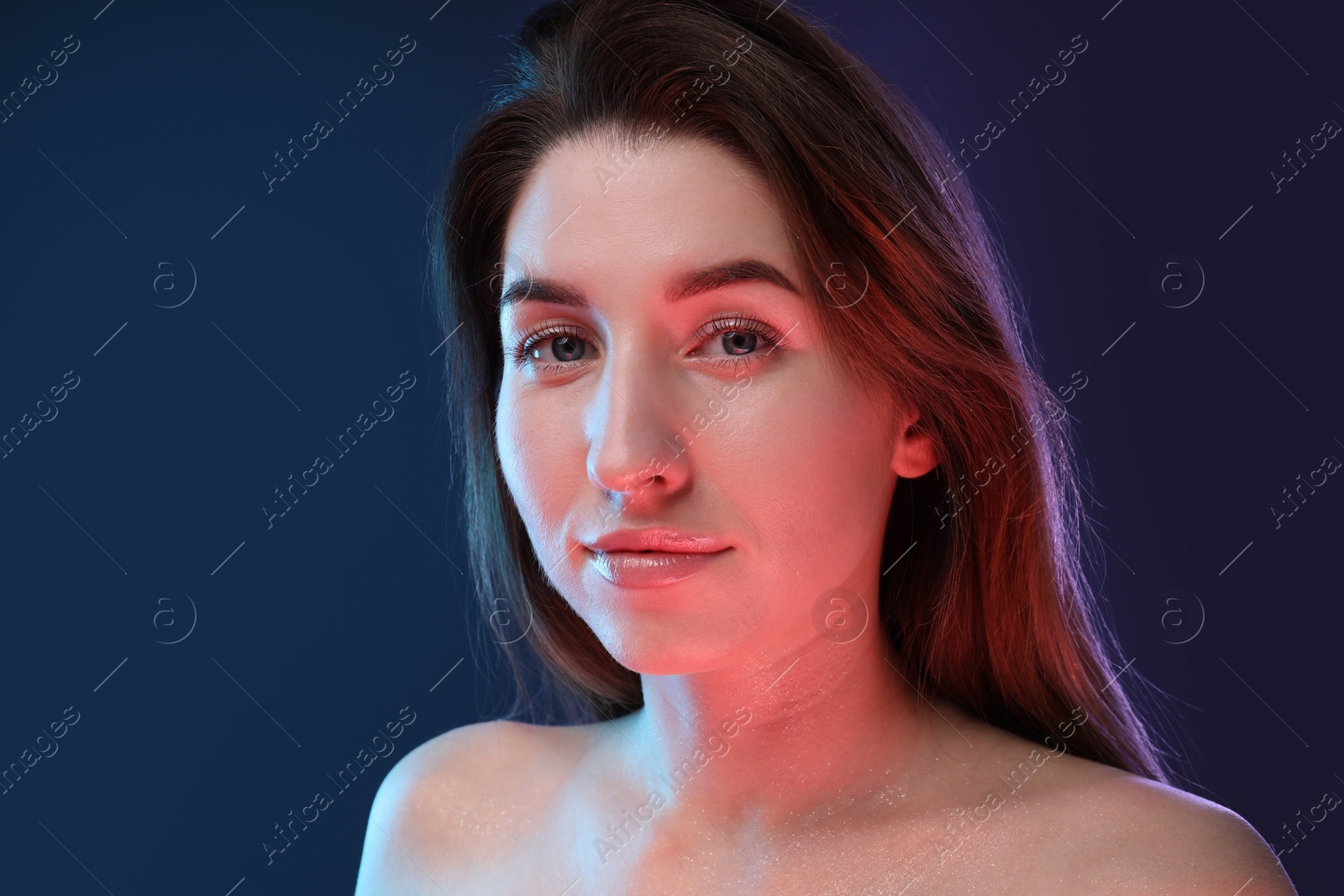 Photo of Portrait of beautiful young woman on color background