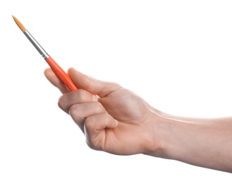 Photo of Man holding paint brush on white background, closeup