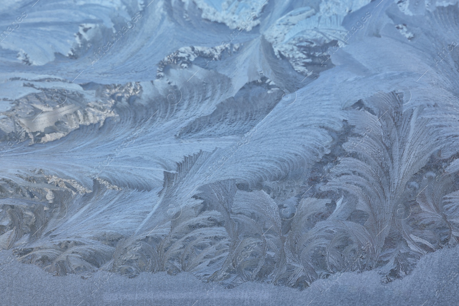 Photo of Beautiful frosty window as background, closeup. Winter morning