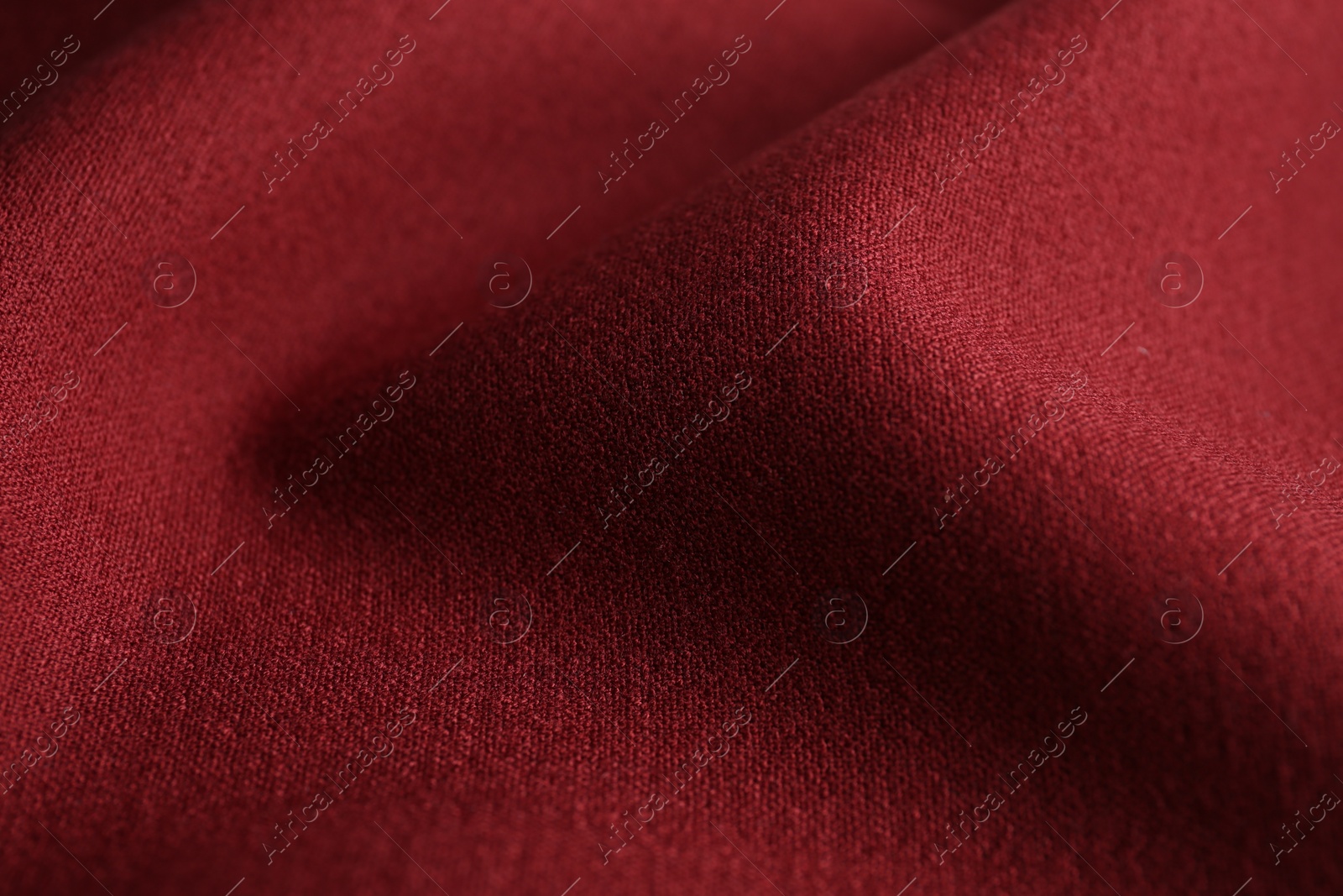 Photo of Texture of beautiful red fabric as background, closeup