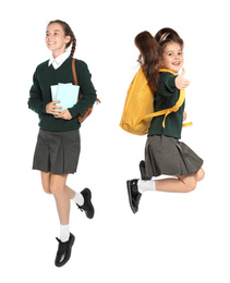 Image of Children in school uniform jumping on white background
