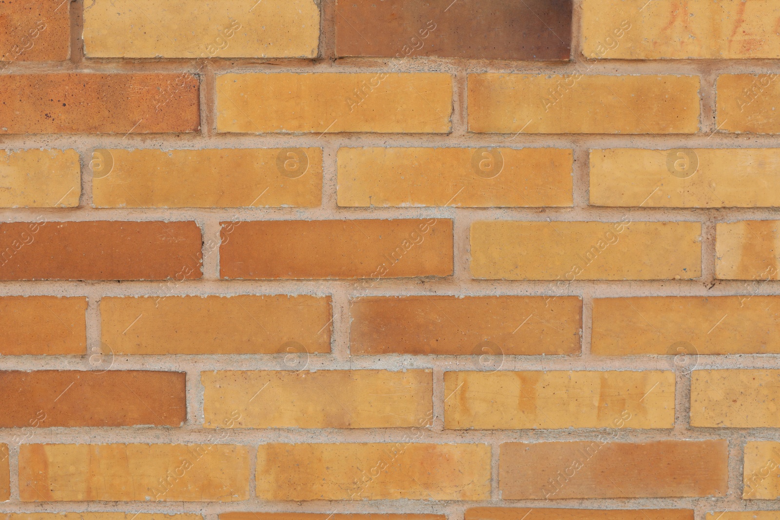 Photo of Texture of beige brick wall as background