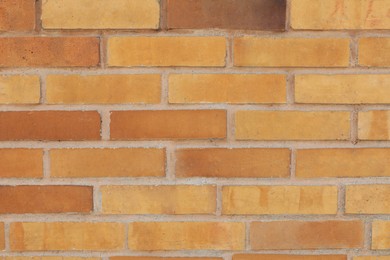 Photo of Texture of beige brick wall as background