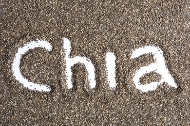 Photo of Word CHIA written in seeds on white background, top view