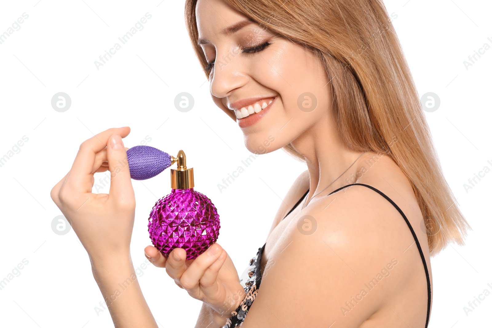 Photo of Young woman with bottle of perfume isolated on white