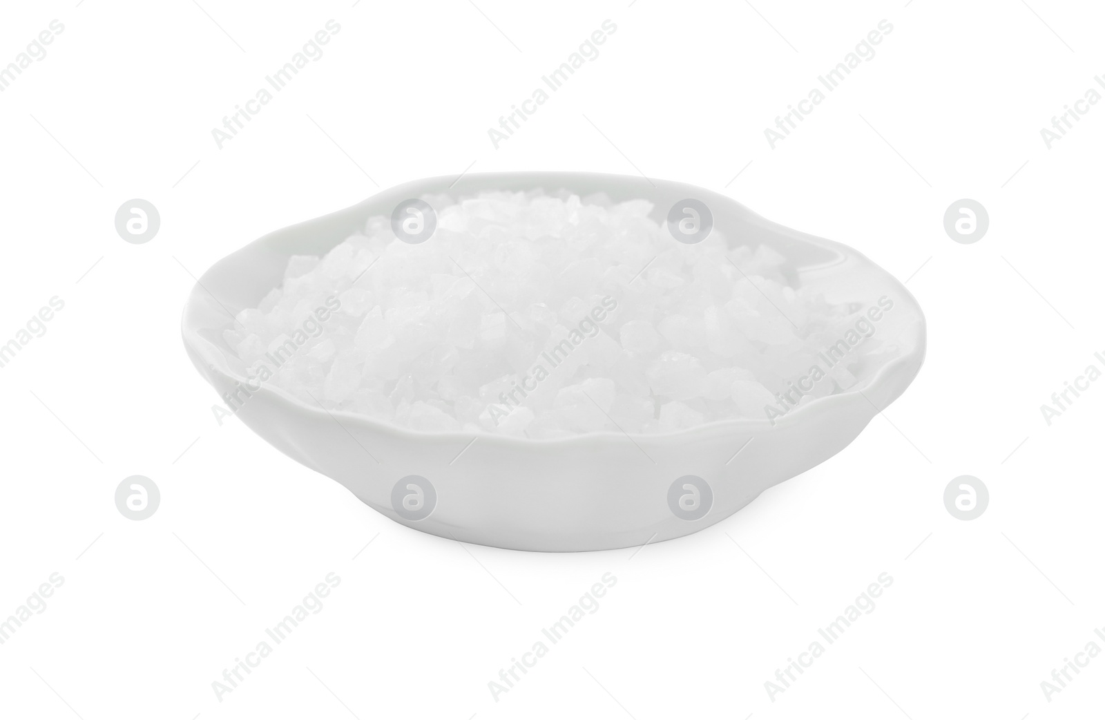 Photo of Plate with natural sea salt isolated on white