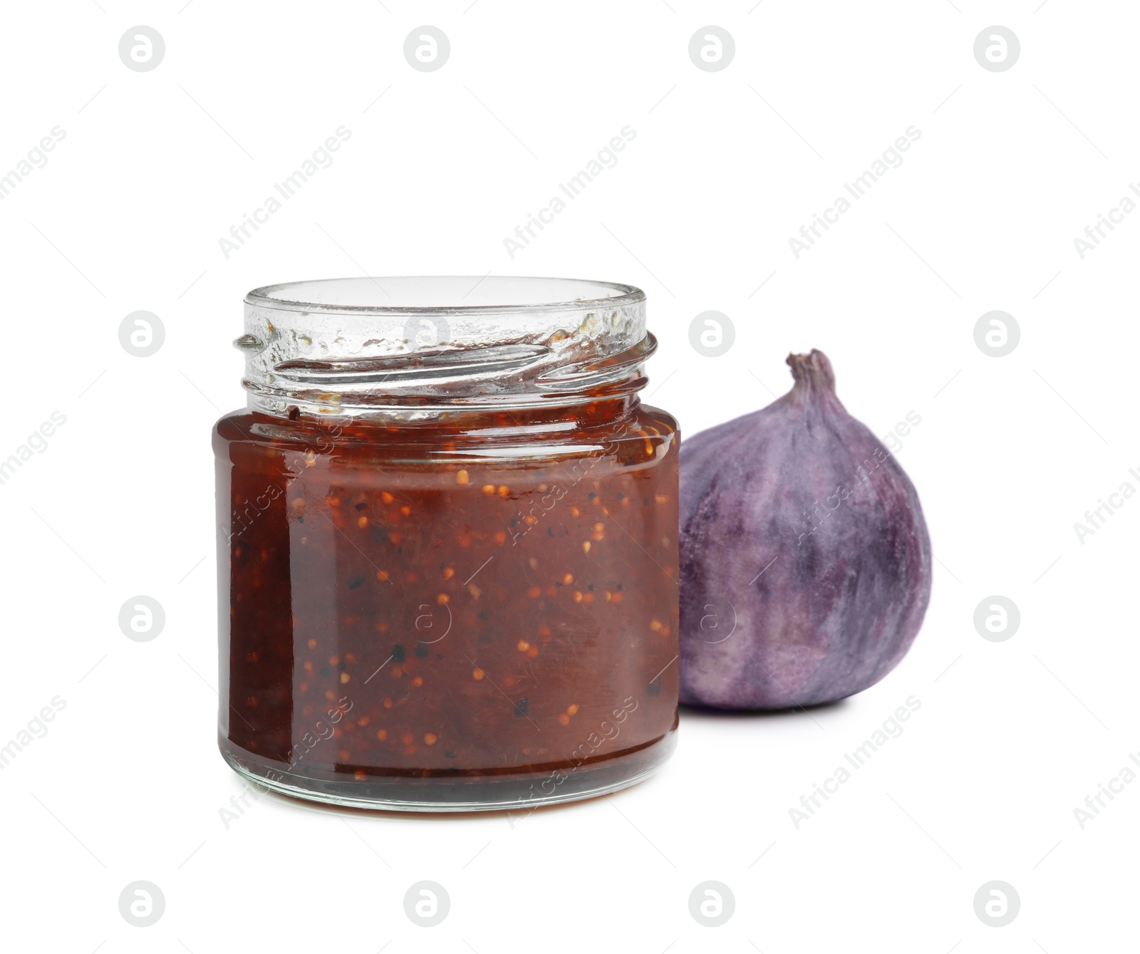 Photo of Glass jar of tasty sweet fig jam isolated on white