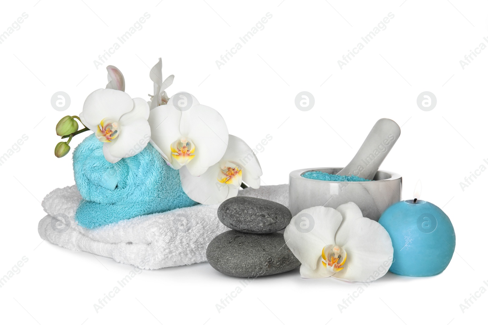 Photo of Composition with spa stones and candle on white background